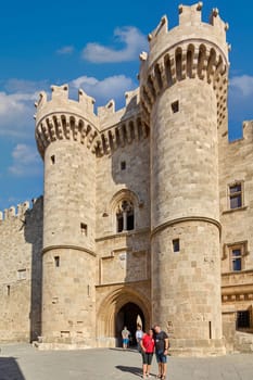 Rodas.Greece - june 01, 2025: Majestic main entrance of the historic Grand Master's Palace with imposing twin towers, showcasing medieval architecture under a brilliant blue sky.
