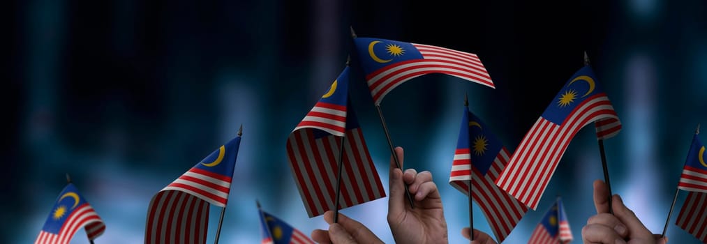 Malaysia flags in their hands on a blurred urban background. The photo illustration was created without the use of artificial intelligence, only using Photoshop.