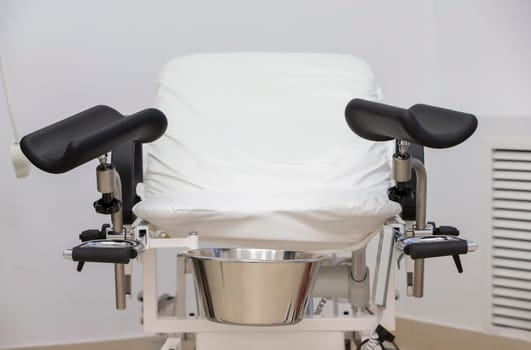Gynecological chair close-up. Medical chair for urological and gynecological operations.
