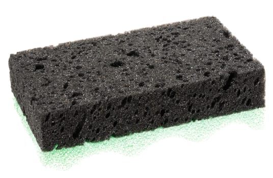 Rectangular piece of black porous sponge. Close-up on isolated background