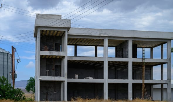 Partially built structure with exposed concrete and rebar, typical of construction sites across Cyprus, awaiting completion or further development.