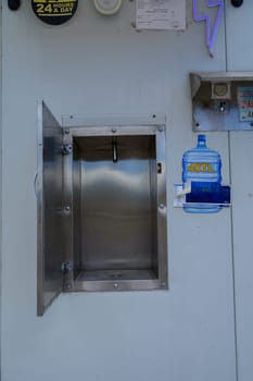 Automatic water vending container providing clean drinking water in a residential area of Cyprus. Convenient and eco-friendly hydration solution.