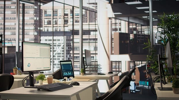 Empty modern workspace with advanced technology to enhance efficiency and productivity, helping business professionals focus on financial strategies. Global enterprise success objectives.