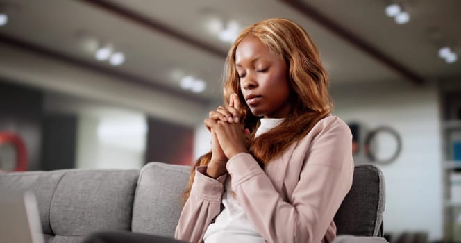 African American Woman Meditating On Sofa, Spiritual Healer And Yoga Instructor