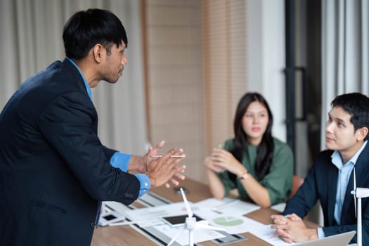 A dynamic meeting where business professionals discuss ESG initiatives, emphasizing sustainability and ethical governance in a corporate environment.
