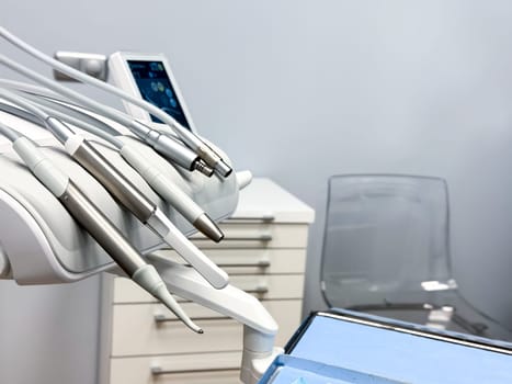 Modern dental tools in a clean and bright clinic setting. High quality.
