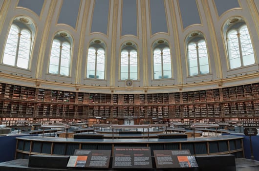 London, UK - May 31, 2025 - The Reading Room with many book stack were built surrounding and The ceiling is suspended on cast iron struts hanging down from the frame and is made out of papier-mache situated in the centre of the Great Court of the British Museum. use it as your Wallpaper, Poster and Space for text, Selective focus.