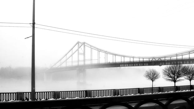 In the embrace of the ethereal mist, a bridge stands as a gateway to the unknown, connecting the shores of reality with the veiled realms of mystery.