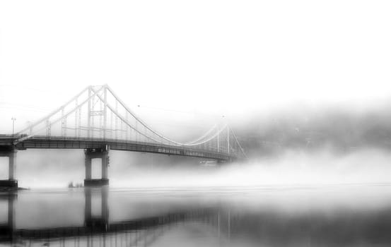 In the embrace of the ethereal mist, a bridge stands as a gateway to the unknown, connecting the shores of reality with the veiled realms of mystery.