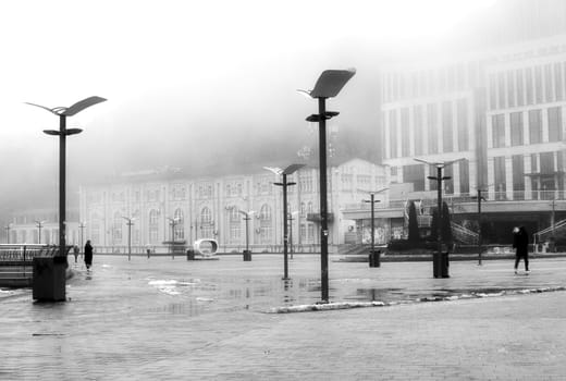 Encased in a dense layer of mist, the waterfront becomes a mysterious and captivating domain. High quality photo