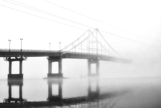 In the embrace of the ethereal mist, a bridge stands as a gateway to the unknown, connecting the shores of reality with the veiled realms of mystery.