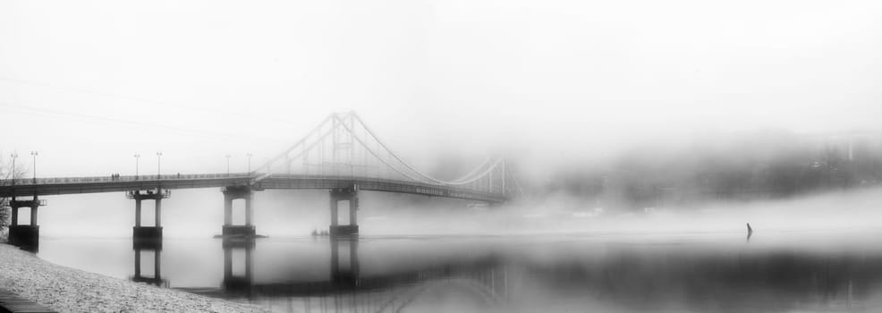 In the embrace of the ethereal mist, a bridge stands as a gateway to the unknown, connecting the shores of reality with the veiled realms of mystery.
