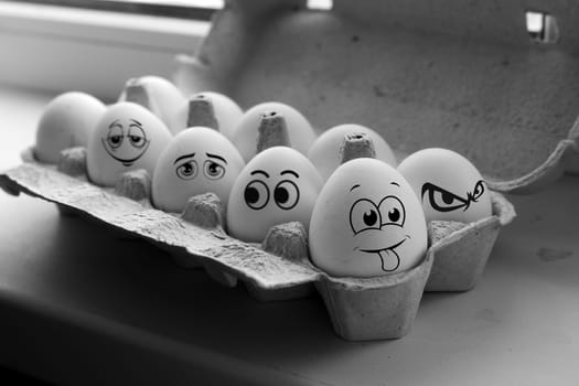 The photograph captures the essence of light and shadow as it plays across two eggs, highlighting their contours and creating a stark, yet beautiful, monochrome scene.