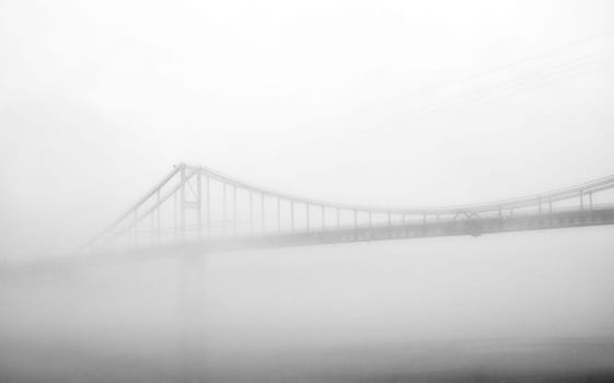 In the embrace of the ethereal mist, a bridge stands as a gateway to the unknown, connecting the shores of reality with the veiled realms of mystery.