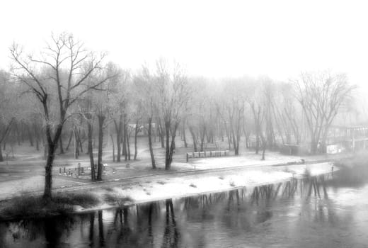 The thick fog lends an air of mystery to the scene, softening the edges of the landscape and blurring the boundaries between reality and imagination.