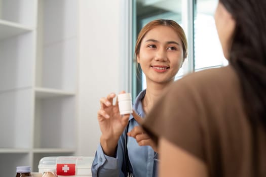 A healthcare provider engages with a patient, explaining a prescription bottle, fostering understanding and trust.