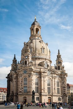 Heavily ruined in WWII and then restored Frauenkirche (Our Lady church) and statue of Martin Luther in the center of old town, Dresden, Germany.