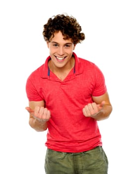 Excited young fellow posing right in front of camera