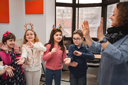 Teacher and elementary students at language school class.