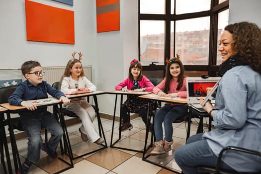 Woman teaching a group of elementary students at language school.