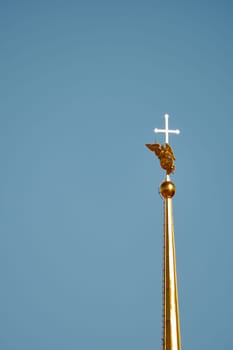 the Peter and Paul Fortress spire at sunset. High quality photo