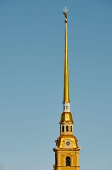 the Peter and Paul Fortress spire at sunset. High quality photo