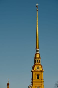 the Peter and Paul Fortress spire at sunset. High quality photo