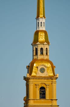 the Peter and Paul Fortress spire at sunset. High quality photo
