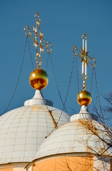 domes with golden crosses of the Prince Vladimir Cathedral on a sunny day. High quality photo
