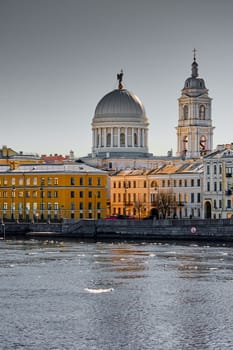 Russia, St.Petersburg, 27 March 2025: Church of St. Catherine the Great Martyr on a sunny spring day, Makarov Embankment, ice drift on the Neva River. High quality photo