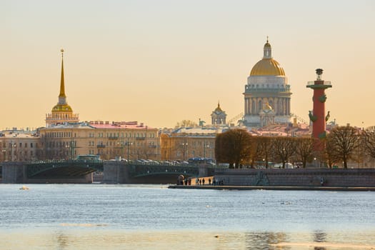 ice drift on the Neva River with a view of the arrow of Vasilyevsky Island with rostral columns, the Winter Palace, St. Isaac's Cathedral, the Savior on Spilled Blood. High quality photo