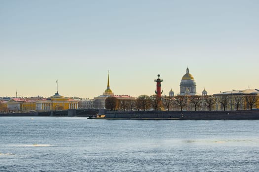 ice drift on the Neva River with a view of the arrow of Vasilyevsky Island with rostral columns, the Winter Palace, St. Isaac's Cathedral, the Savior on Spilled Blood. High quality photo
