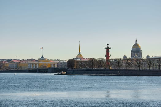 ice drift on the Neva River with a view of the arrow of Vasilyevsky Island with rostral columns, the Winter Palace, St. Isaac's Cathedral, the Savior on Spilled Blood. High quality photo