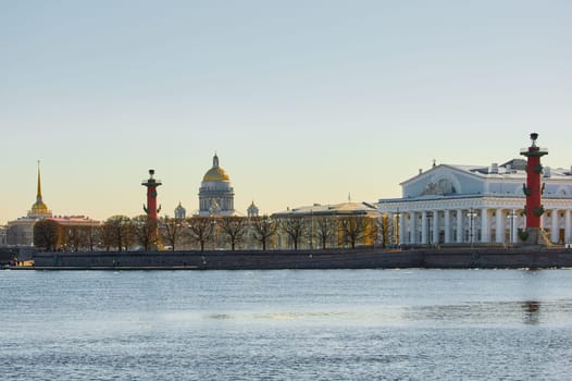 ice drift on the Neva River with a view of the arrow of Vasilyevsky Island with rostral columns, the Winter Palace, St. Isaac's Cathedral, the Savior on Spilled Blood. High quality photo
