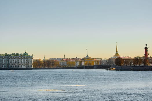 ice drift on the Neva River with a view of the arrow of Vasilyevsky Island with rostral columns, the Winter Palace, St. Isaac's Cathedral, the Savior on Spilled Blood. High quality photo