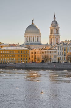 Russia, St.Petersburg, 27 March 2025: Church of St. Catherine the Great Martyr on a sunny spring day, Makarov Embankment, ice drift on the Neva River. High quality photo