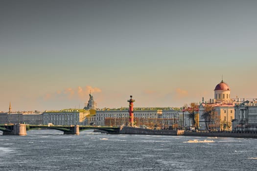 ice drift on the Neva River with a view of the arrow of Vasilyevsky Island with rostral columns, the Winter Palace, St. Isaac's Cathedral, the Savior on Spilled Blood. High quality photo