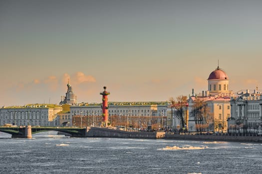 ice drift on the Neva River with a view of the arrow of Vasilyevsky Island with rostral columns, the Winter Palace, St. Isaac's Cathedral, the Savior on Spilled Blood. High quality photo