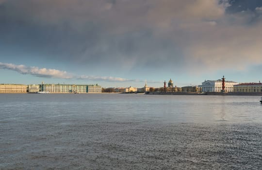 ice drift on the Neva River with a view of the arrow of Vasilyevsky Island with rostral columns, the Winter Palace, St. Isaac's Cathedral, the Savior on Spilled Blood. High quality photo