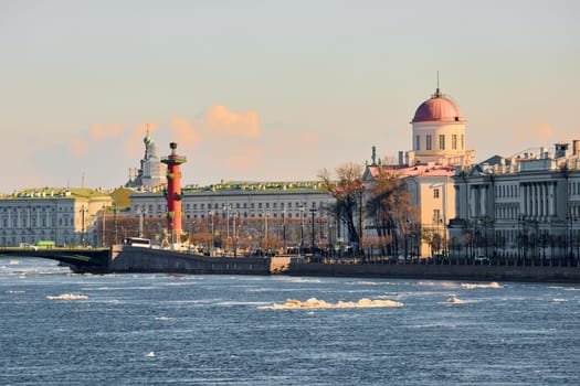 ice drift on the Neva River with a view of the arrow of Vasilyevsky Island with rostral columns, the Winter Palace, St. Isaac's Cathedral, the Savior on Spilled Blood. High quality photo