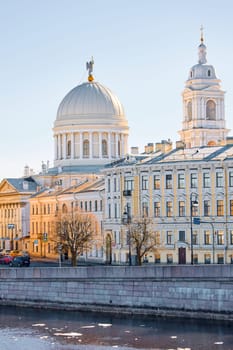 Russia, St.Petersburg, 27 March 2025: Church of St. Catherine the Great Martyr on a sunny spring day, Makarov Embankment, ice drift on the Neva River. High quality photo