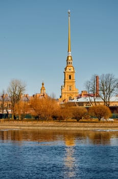 the Peter and Paul Fortress spire at sunset. High quality photo