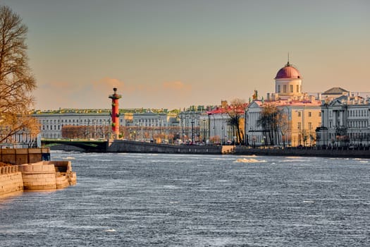 ice drift on the Neva River with a view of the arrow of Vasilyevsky Island with rostral columns, the Winter Palace, St. Isaac's Cathedral, the Savior on Spilled Blood. High quality photo
