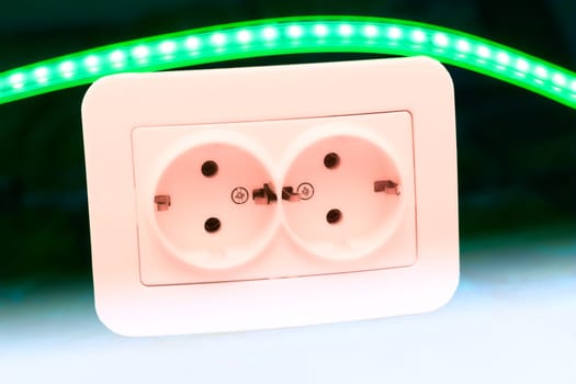 able to be connected by means of a plug. an electrical device receiving a plug or light bulb to make a connection