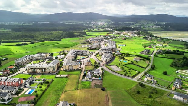 Aerial photos showcase the stunning beauty of green fields, riverbanks, and quaint villages in an idyllic setting