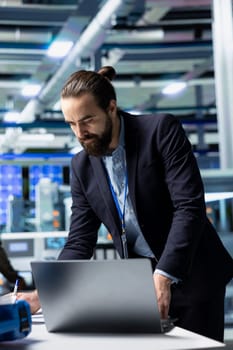 General director in formal suit conducting inspection in a solar panel plant, symbolizing modern infrastructure and leadership in green energy industry. Production planning and technology.
