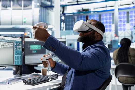 Solar panels factory engineer using VR headset to improve solar energy automation, eco friendly. Photovoltaics manufacturing plant specialist using virtual reality equipment, high tech.