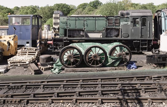 Royal Tunbridge Wells, UK - Apr 30, 2025 - Train carriages and parts awaiting reassembly or are undergoing repairs on rail yards of the Tunbridge Wells railway station. use it as your Wallpaper, Poster and Copy space, Selective focus.