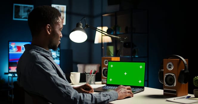 Self employed person checking financial graphs on chroma key screen, researching and sharing insight. Remote worker comparing business graphic economic figures, creating a strategy. Camera A.