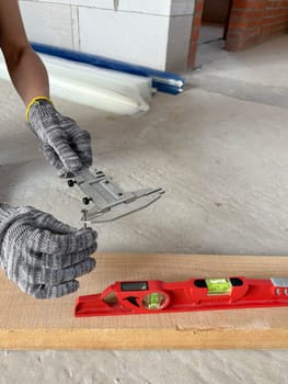 Caliper and level for measuring during construction of a residential building. Measuring tools at the construction site.